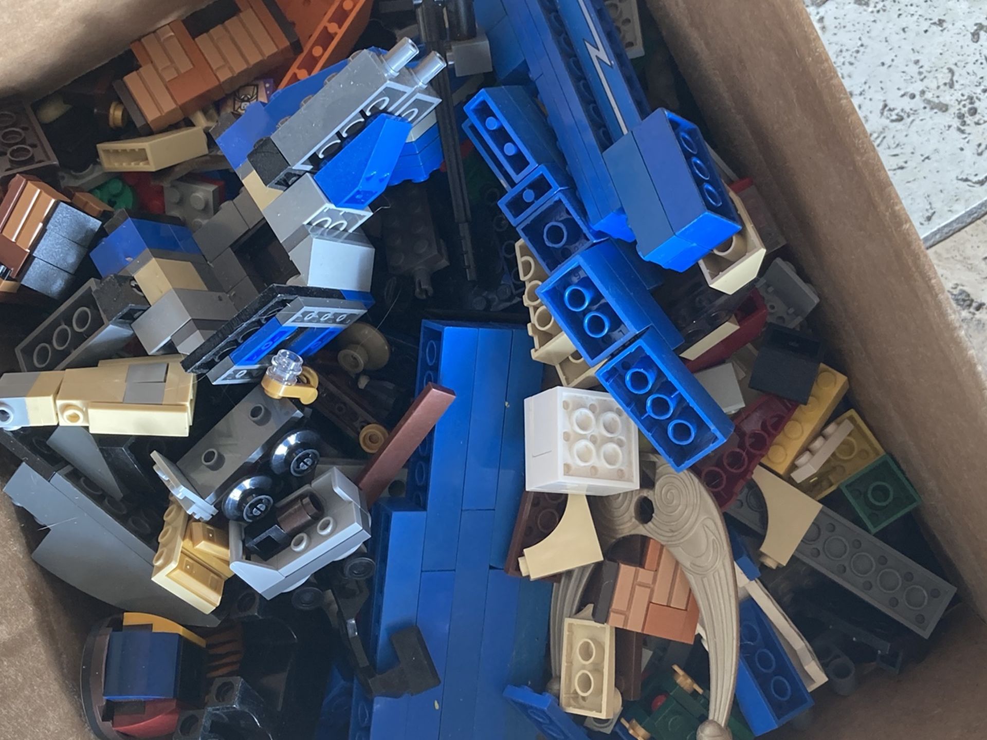 Approximately 14 pounds of LEGO and perhaps some other building bricks blocks toys toy