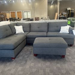 Black Linen Sectional And Ottoman 