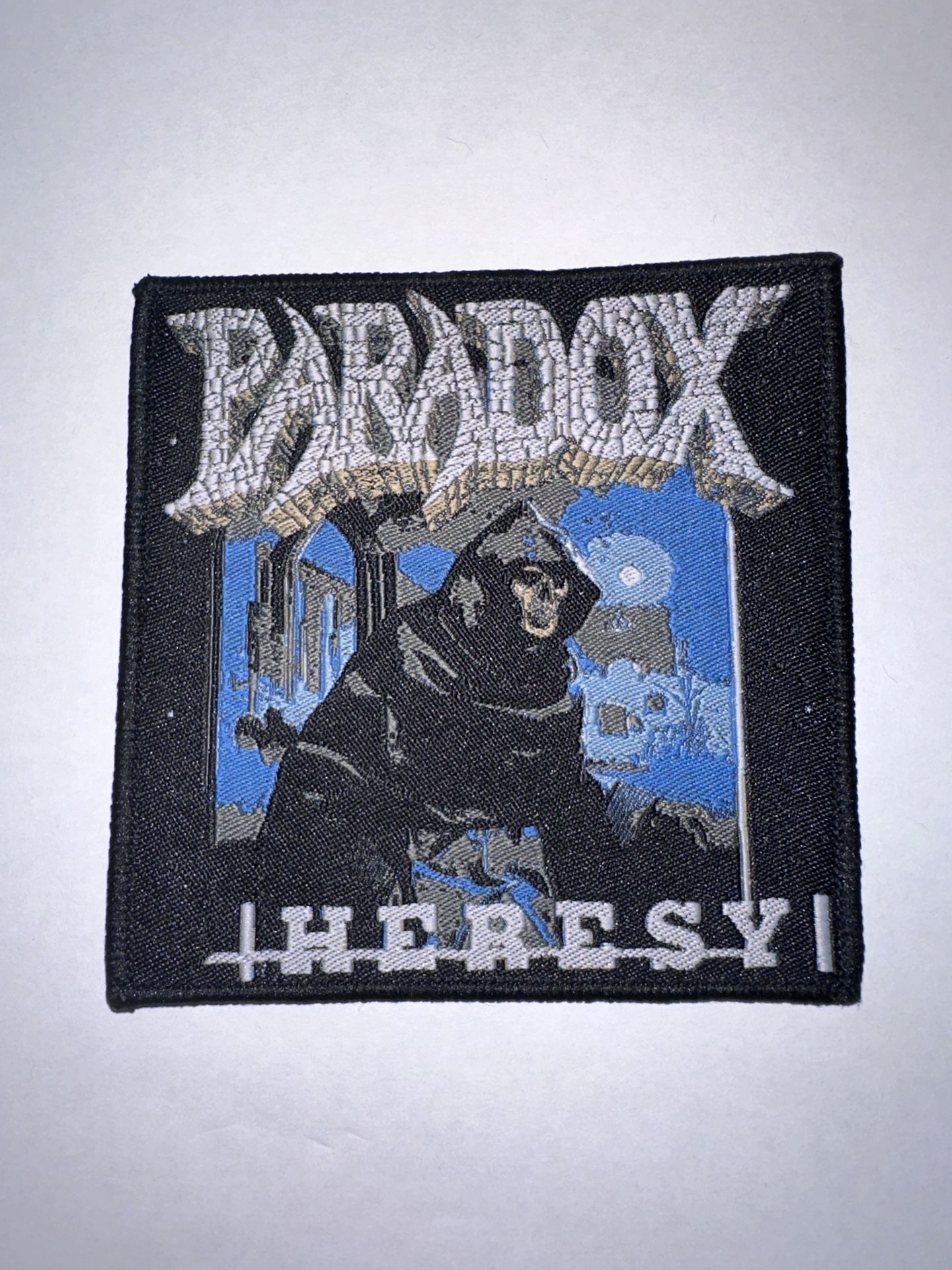 PARADOX, HERESY,SEW ON BLACK BORDER WOVEN PATCH