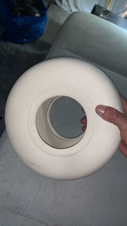 Modern white donut ceramic vase.