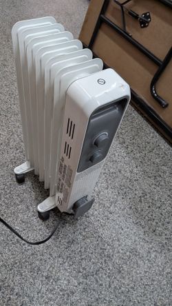 OIL-FILLED RADIATOR HEATER. CITY OF ORANGE. $20