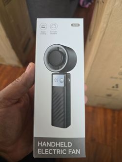 Handheld electric fan.