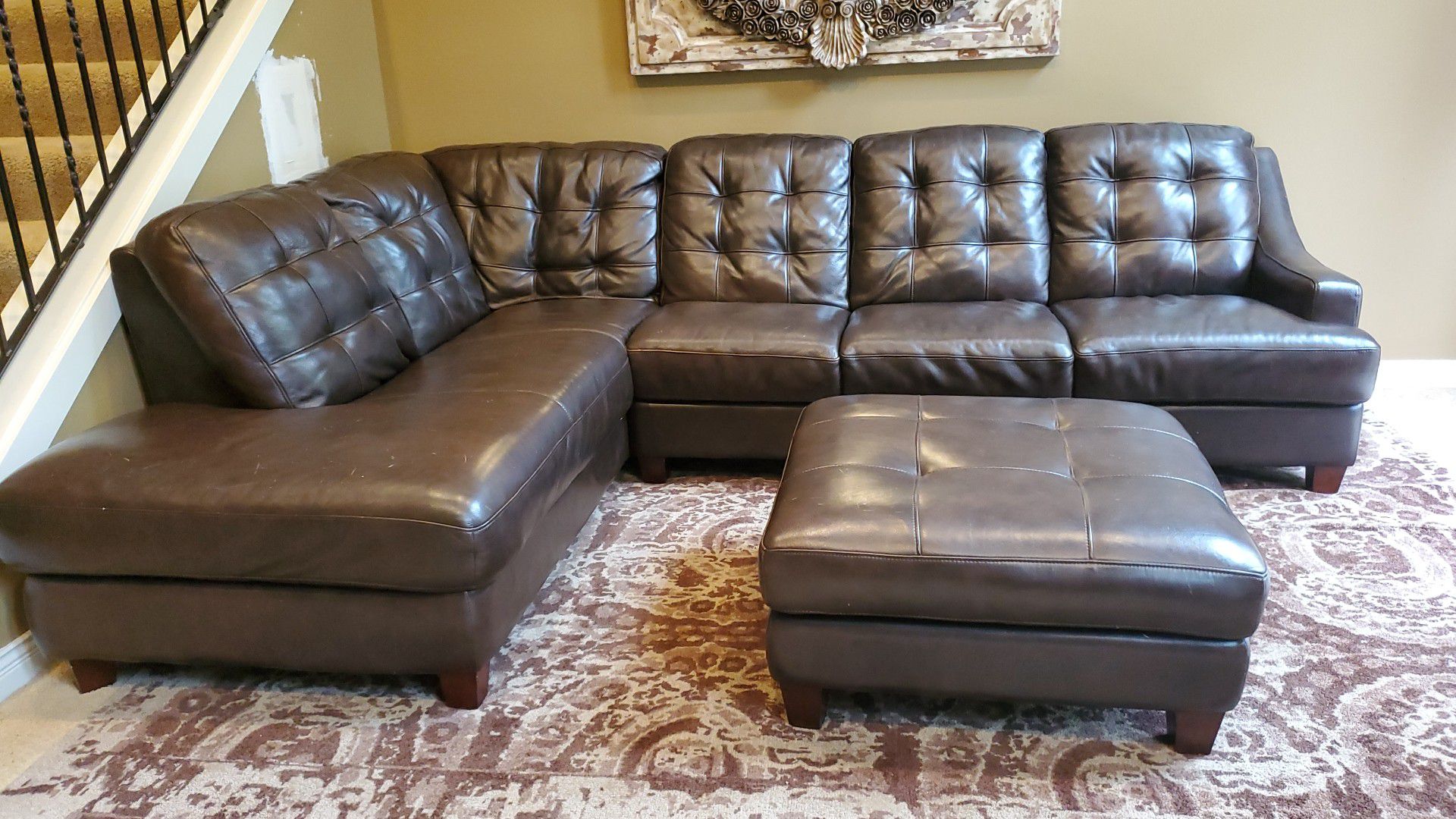 Mercer brown leather sectional couch with storage ottoman