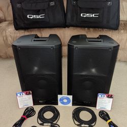 2 QSC K12 Powered Speakers - Complete Setup with Bags, Stands & Cables