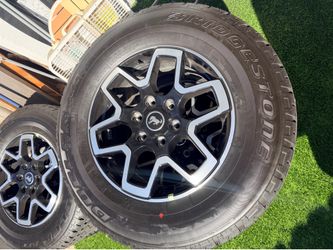 Bridgestone 255-70-18 tires, 5 brand new with wheels