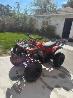 Orange Gas-Powered ATV Four Wheeler