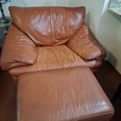 Leather sofa and chair with ottoman. 