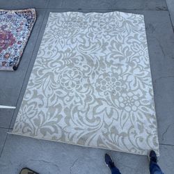 White and beige tan rug