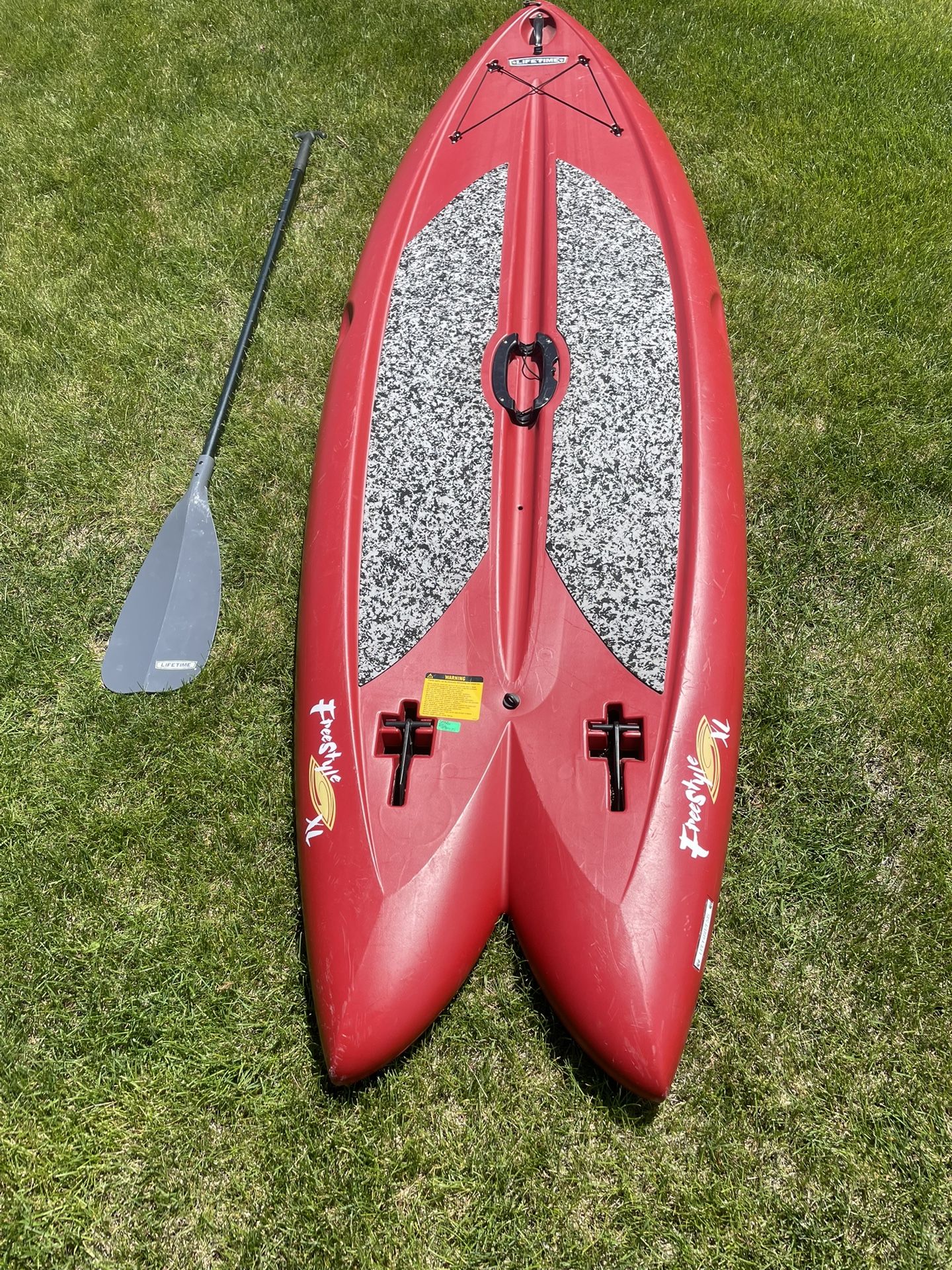FreeStyle XL Stand up Paddle Board w/ paddle and built-in folding fins.