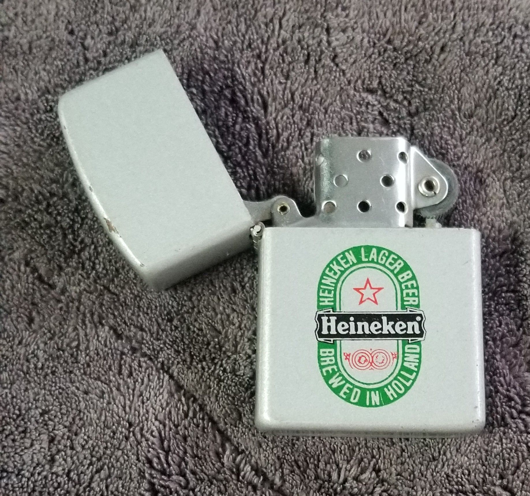 Heineken Zippo style flip top Lighter & flipping the bird