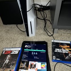 PS5 WITH GAMES & 2 CONTROLLERS