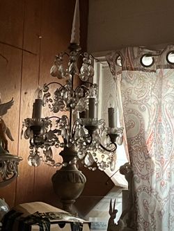 Antique chandeliers , authentic monogram Kate spade plates  and 1 baccarat candle holder