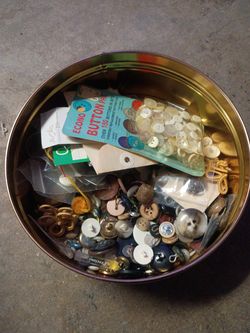 Tin of old buttons
