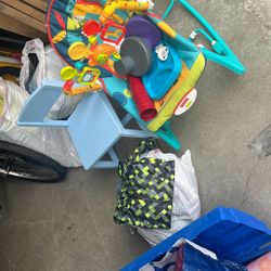 Baby carrier plays music and vibrates with baby utensils chair and baby clothes all for $25