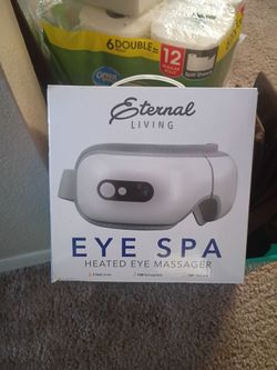 Heated eye massager