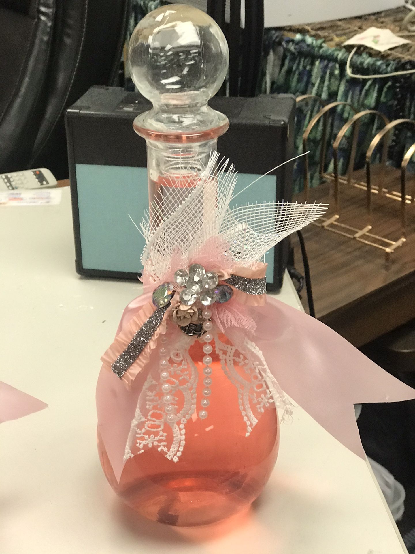 Antique bottles with rose bubble bath .