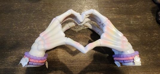 Heart Shaped Skeleton Hands With Bracelets