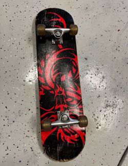 Skateboard with Dragon Graphic
