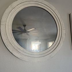 Round mirror and matching decorative candle holders