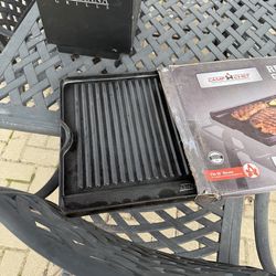 Reversible cast iron griddle topper for stove