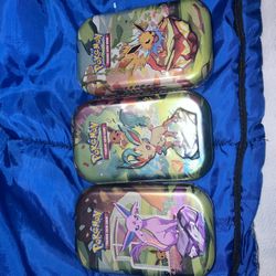 Pokemon Prismatic Evolution Tins 