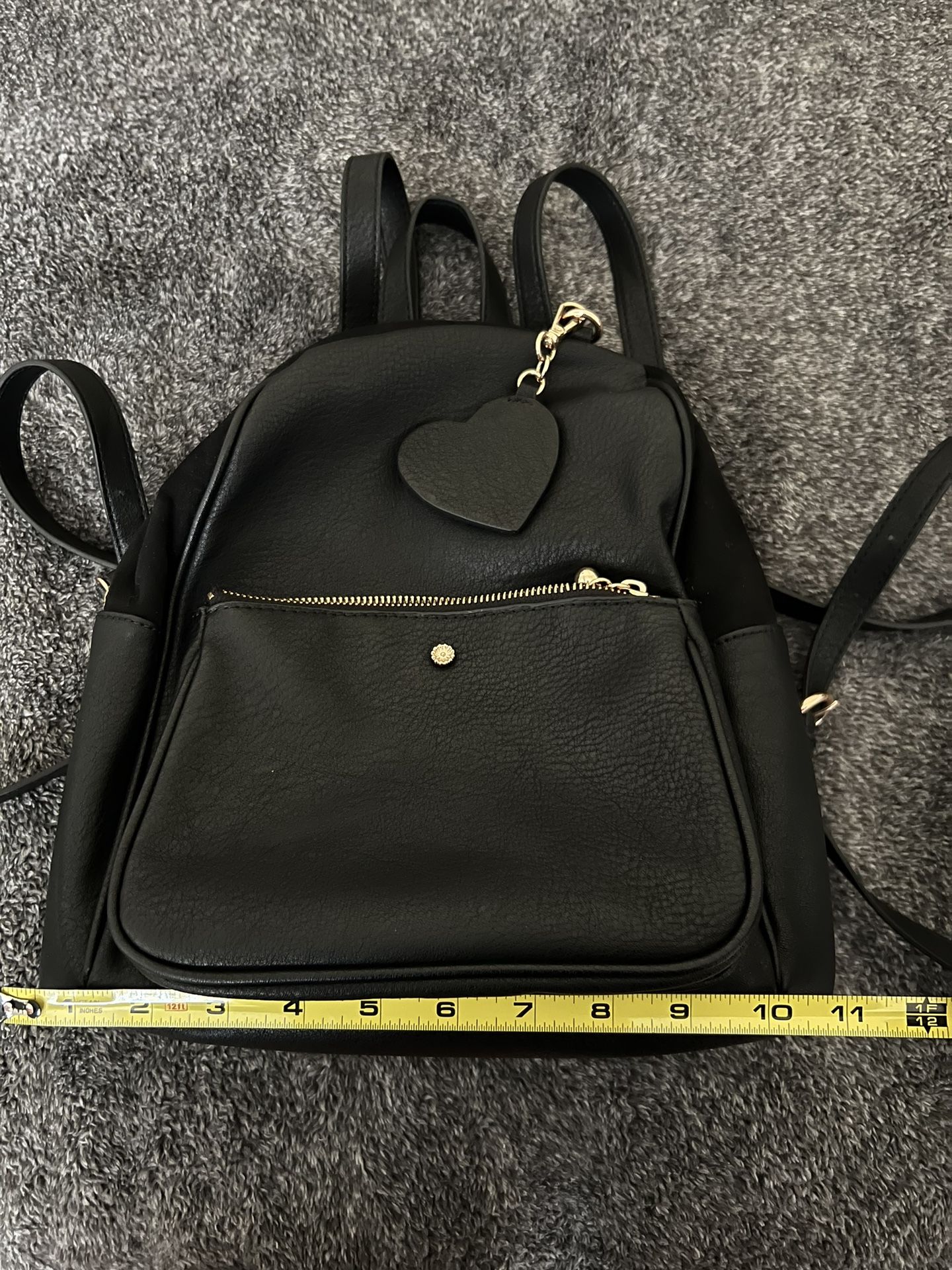 Black Backpack With Heart Tag