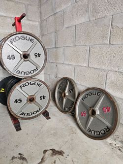 4 Rogue 45LB Machined Olympic Weight Plates. Homestead 33033. Delivery fee.

Heavy-duty cast-iron Rogue 45lb machined Olympic weight plates come in a 