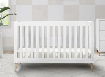 White crib with mattress