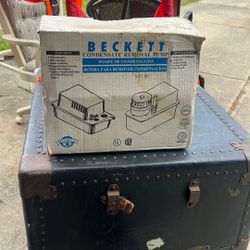 The product in the image is a Beckett CU451UL Condensate Removal Pump. This is a heavy-duty pump designed for removing condensation from various HVAC 