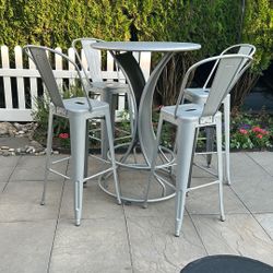 Bar height patio table and 4 chairs 
