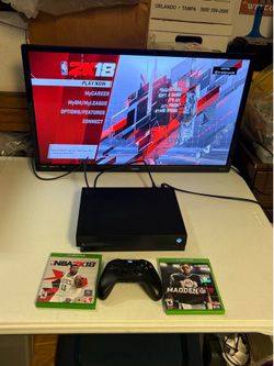 Microsoft Xbox One X console system with controller, 2 games and cord.