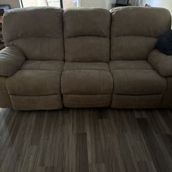 Power Reclining Couch And Chair With End table. Faux Leather