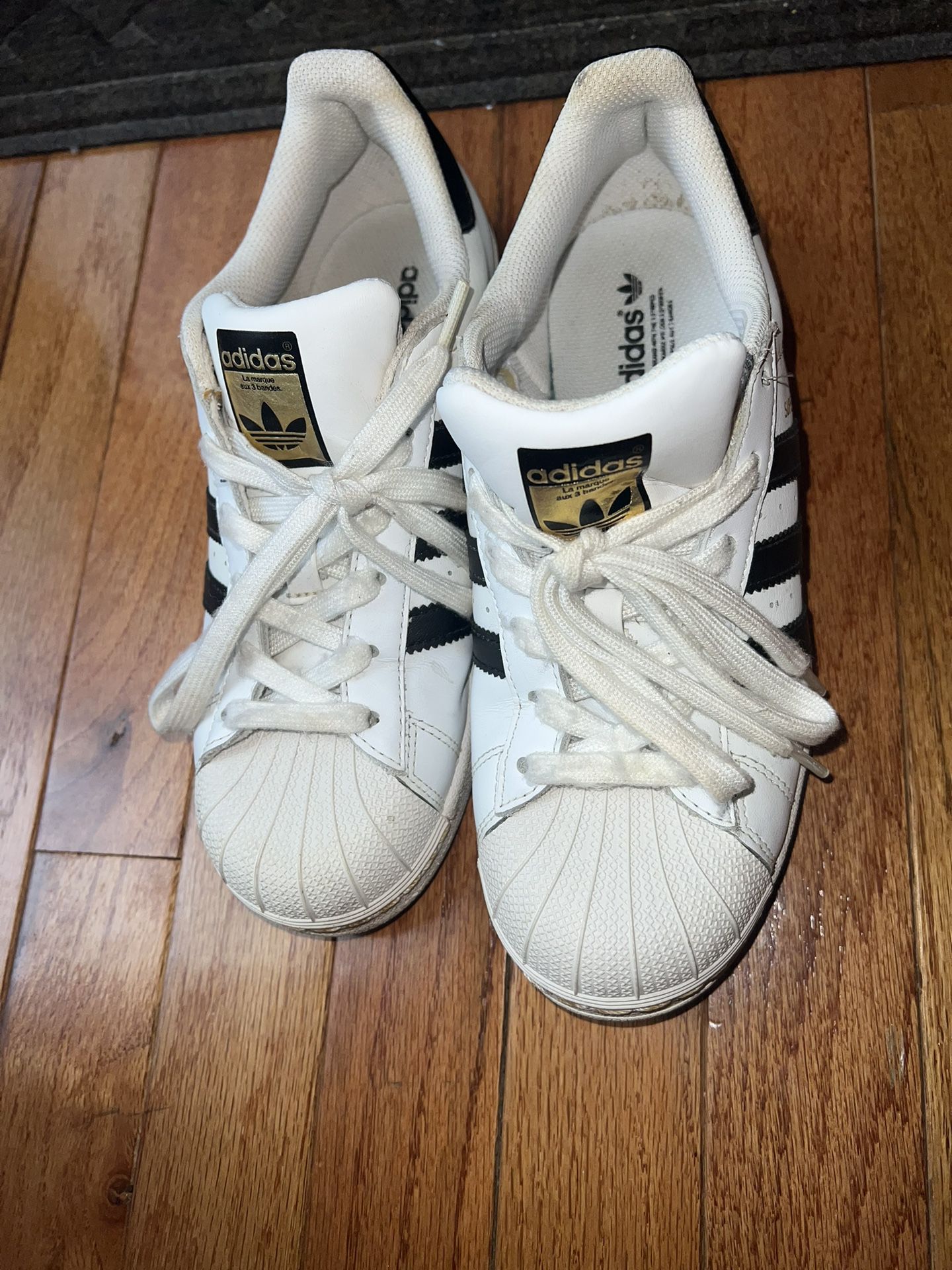 Classic Adidas Superstar Sneakers in Black & White with Gold Accents
