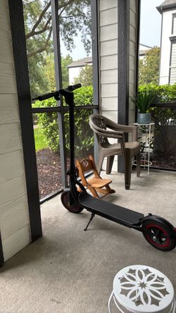 Black Electric Scooter with Red Accent Wheels