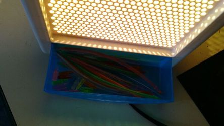 Kids light brite box with assorted pegs