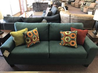 Teal Ashley Furniture sofa and loveseat