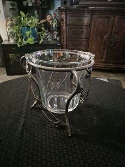 Glass and metal.
Price twenty five dollars no less