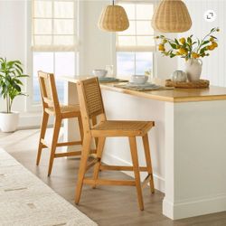 Two woven bar stools
