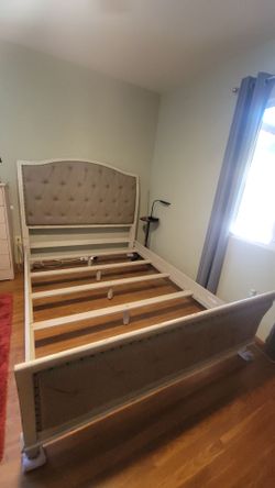 Queen size bed frame with headboard and hanging mirror