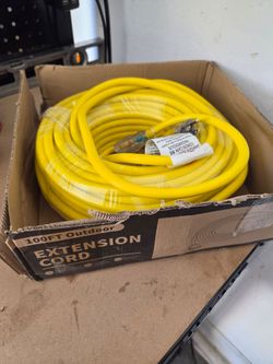100-foot outdoor extension cord featuring a 12AWG heavy-duty rating and a power light indicator.