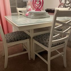 White-stressed Counter Height Table W Glass Top And 4 Chairs