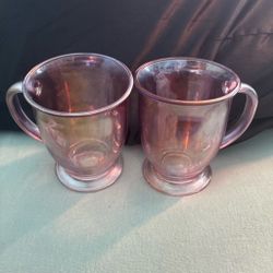 2 Pink iridescent glass mugs