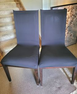 FREE 6 used solid wood dining chairs with slip cover. Will b a good DIY project to reupholster