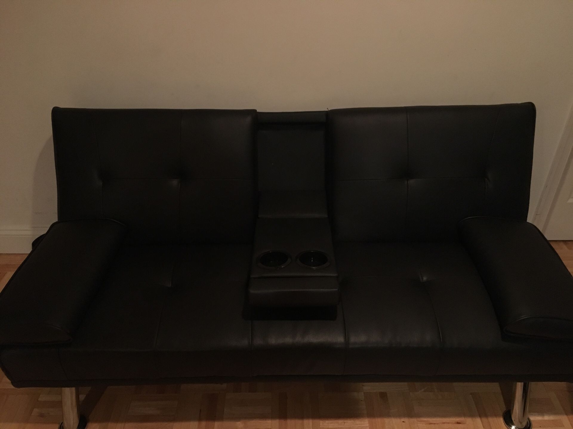 Black futon with cup holders