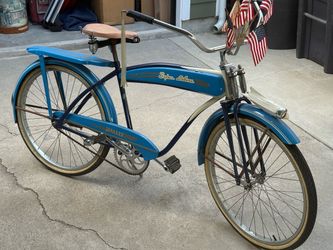 Monark mens  super deluxe-bike with tank and horn rear rack, springer fork excellent condition not sure on year thinking late 50s early 60s  but its s