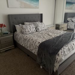 Gray upholstered queen bed frame