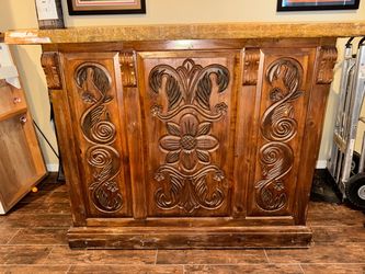 carved wooden home bar