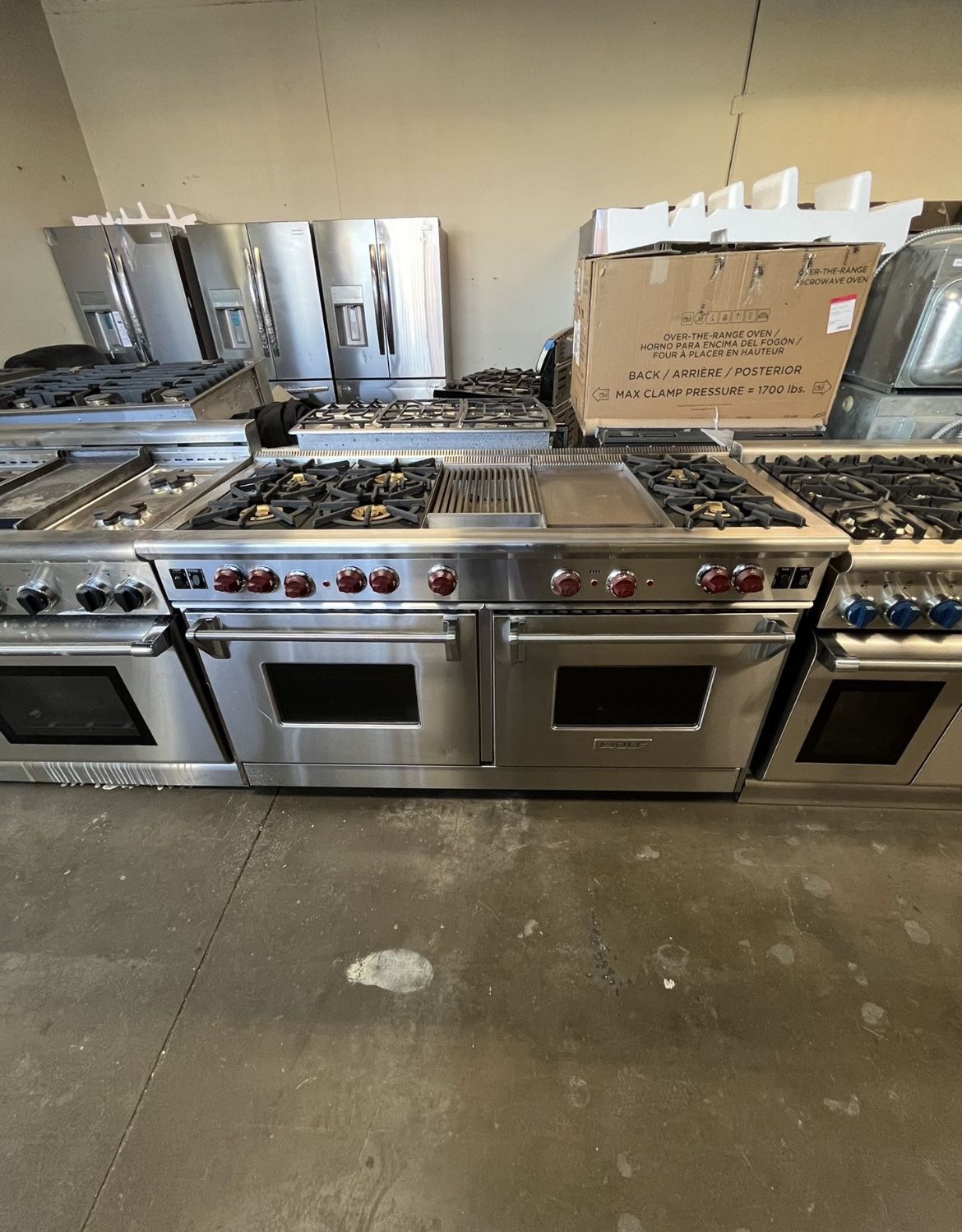 WOLF 60 WIDTH STAINLESS STEEL RANGE WITH RED KNOBS