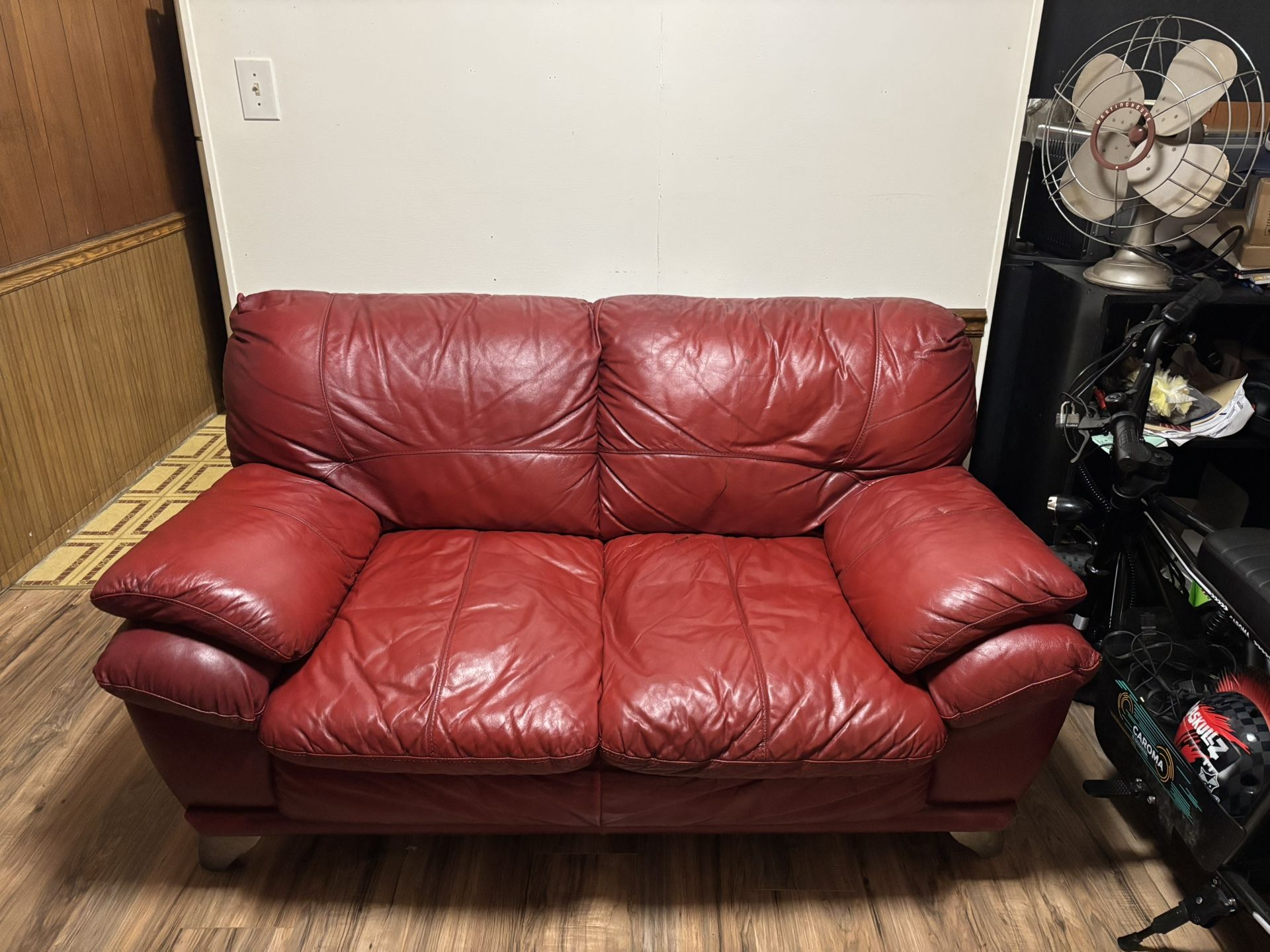 Red leather couch and loveseat