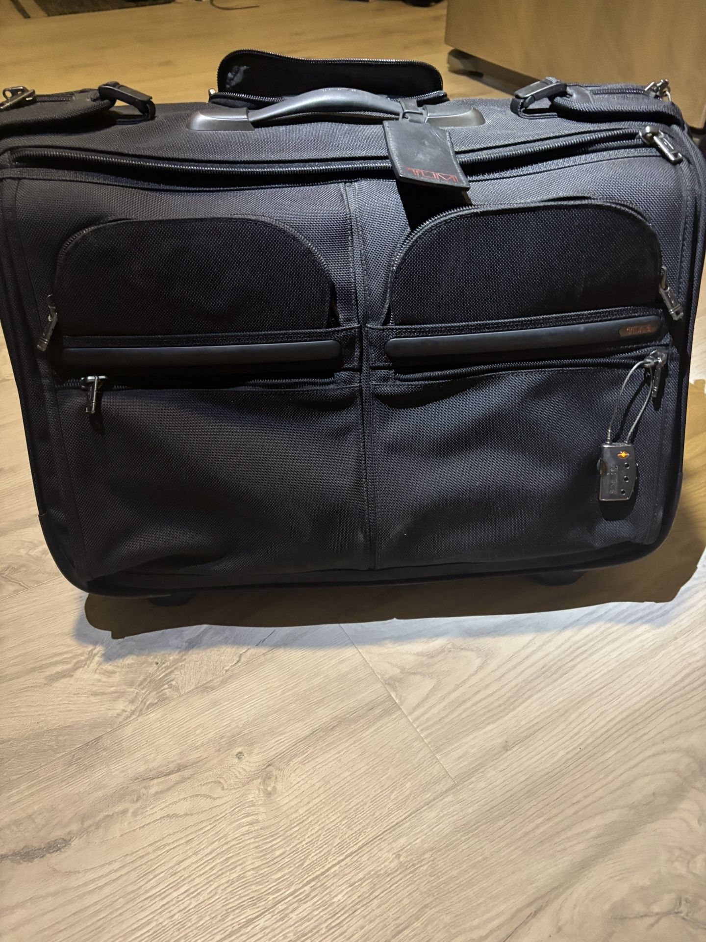 TUMI Black Garment 4 Wheeled Carry On